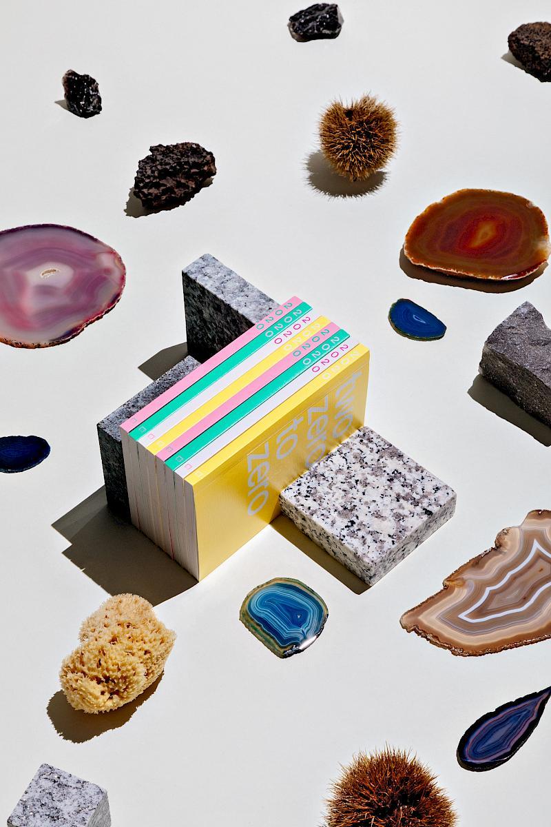 Studio-shot of natural items, stones and a stack of planners