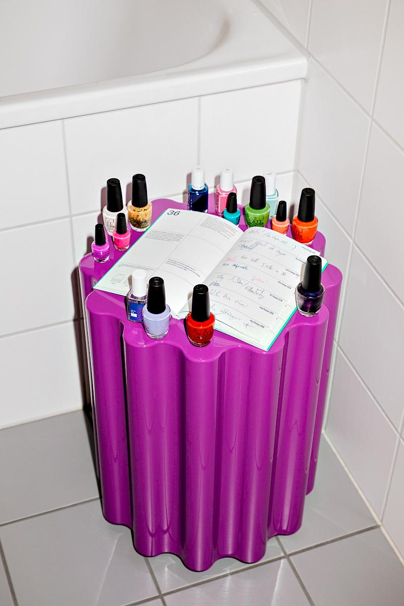 A planner on a Colonna stool by Ettore Sottsass for cartel with too many nail varnishes