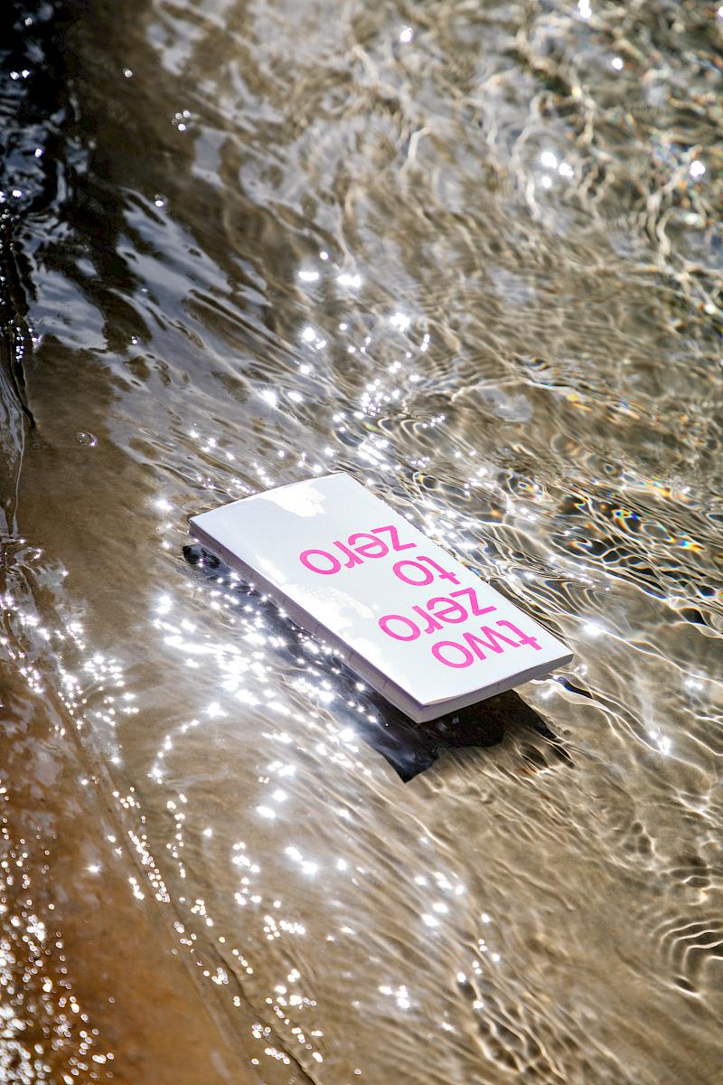 A white planner floating down the river