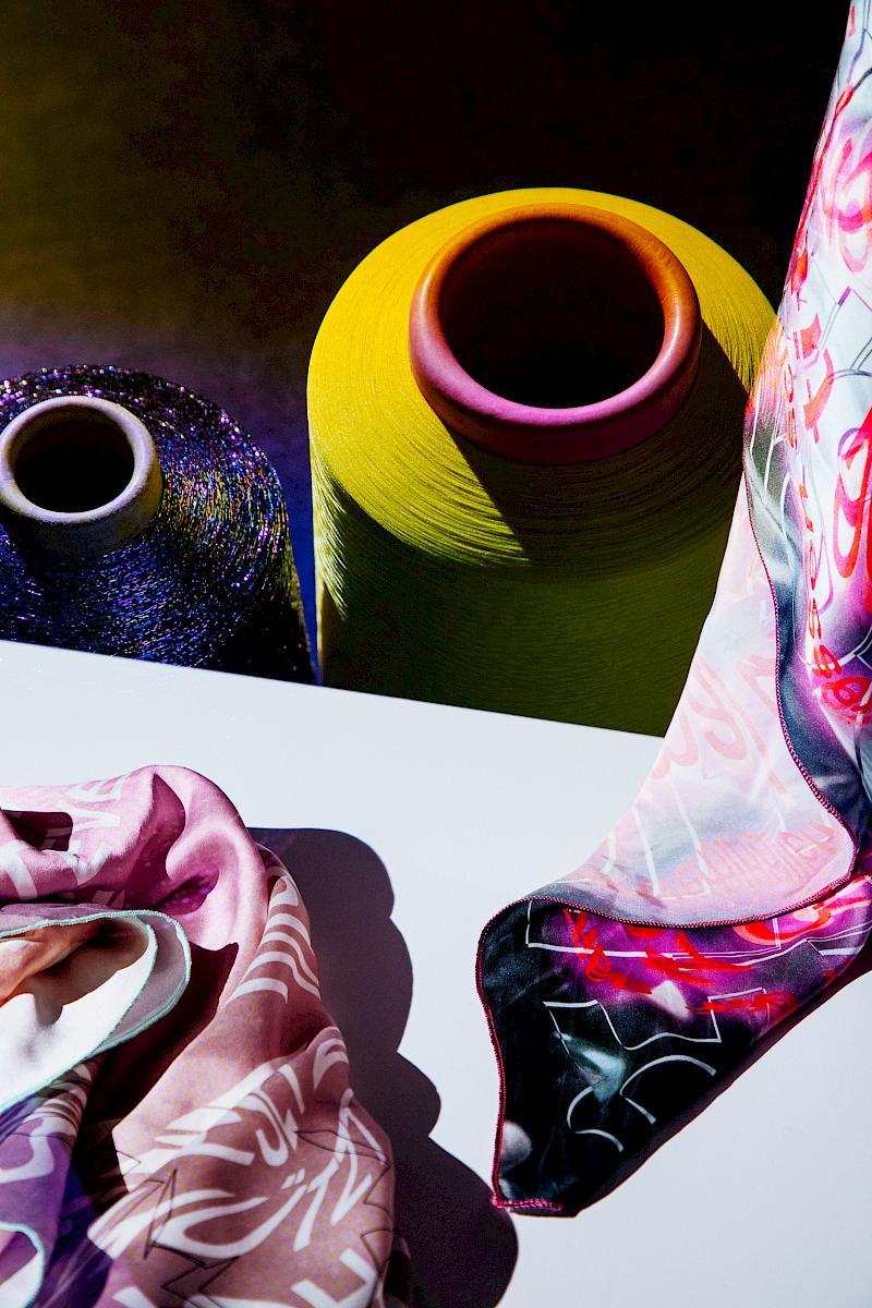 A double exposure of Chiara Elspass's work and two industrial overlock garn