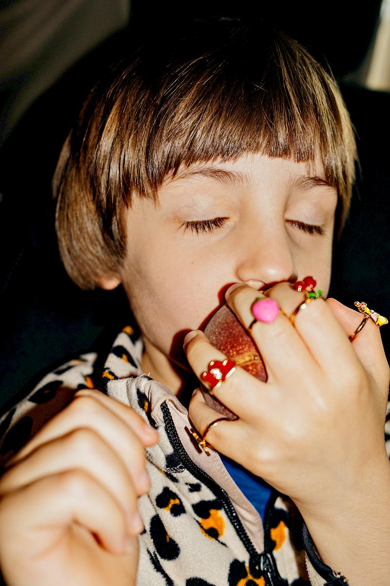 Child eating a peach
