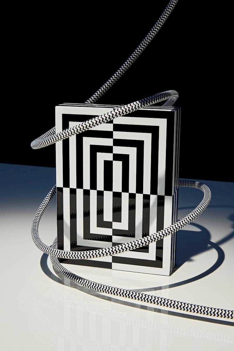 Abstract geometric artwork featuring black-and-white optical patterns